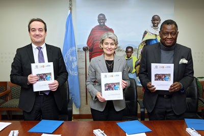 UN Women Deputy Executive Director Yannick Glemarec, UNESCO Director-General Irina Bokova and UNFPA Executive Director Babatunde Osotimehin signed a joint programme agreement dedicated to empowering adolescent girls and young women through education on 23 November. Photo: UN Women/Ryan Brown