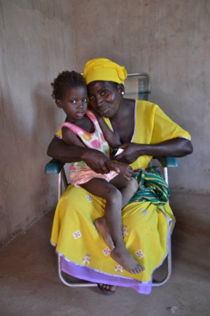 File:Woman with a child to her chest in the Gambia.jpg - Wikimedia