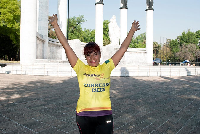 Palmira Martinez celebrates after completing the Carrera Bonafont con Causa 5k. Photo:  UN Women