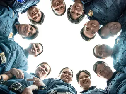 Women look down on the camera forming a circle