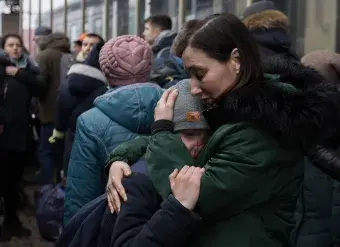 People in Kyiv, Ukraine crowd the train stations trying to get out of the country during the Russian invasion, but the evacuation trains are not enough for everyone. 1 March 2022. Photo: Sebastian Backhaus/Agentur Focus/Redux.
