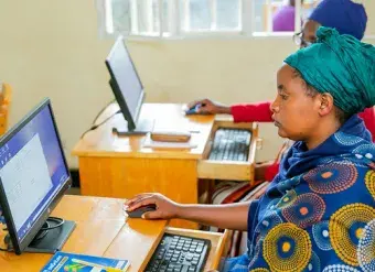Women business owners take part in training at the ICT Chamber, an implementing partner of the Ihuzo platform, which provides digital skills to iWorkers in Rwanda, enabling them to expand their e-commerce activities. Photo courtesy of Rwanda ICT Chamber.