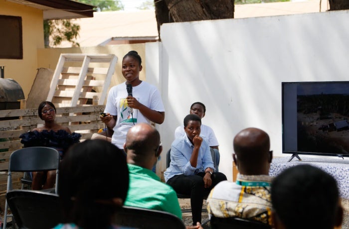 A participant of the Envisioning Resilience initiative in Ghana tells the story behind a photo she captured showing the impacts of climate change on her life. Photo: Dennis Nipah